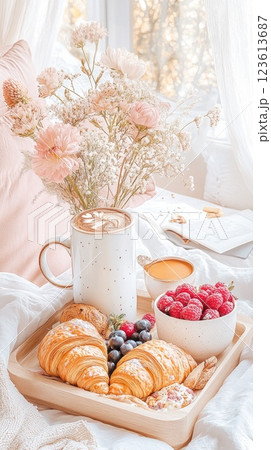 Delightful breakfast spread featuring croissants, berries, and a warm drink on a cozy morning Delightful breakfast spread featuring croissants, berries, and a warm drink on a cozy morning 123613687