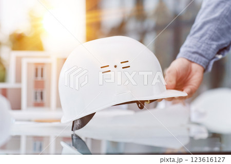 Close up white safety helmet on the table 123616127