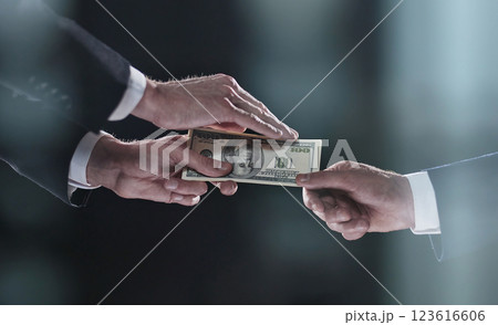transferring money from hand to hand on a black background transferring money from hand to hand on a black background 123616606