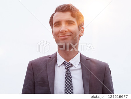 Handsome businessman looking satisfied, smiling a standing over white background Handsome businessman looking satisfied, smiling a standing over white background 123616677
