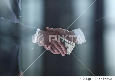 businessman hand giving money on black background 123616698
