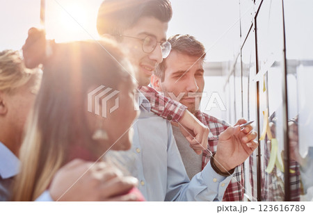 Business people sticking notes in the corridor of a modern office building 123616789