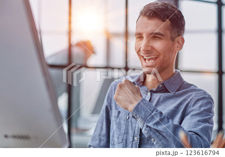 Computer happy professional taking notes, copywriting or research, planning and reading email 123616794