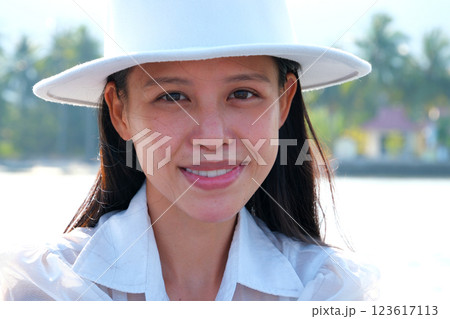 vietnamese girl in white hat classic beauty asian on lake in white clothes governess chic young lady morning with open arms and closed eyes. Mindful woman relax. vietnamese girl in white hat classic beauty asian on lake in white clothes governess chic young lady morning with open arms and closed eyes. Mindful woman relax. 123617113