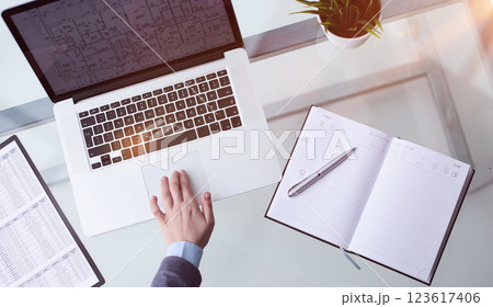 hand using touchpad on laptop at home 123617406