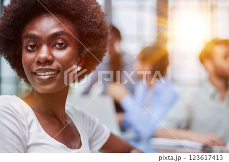 business woman with her staff in background at office 123617413