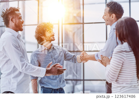 Successful Business Collaboration: Executives Greet with Handshake in Office Successful Business Collaboration: Executives Greet with Handshake in Office 123617486