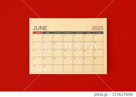 June 2025 desk calendar made from brown paper page on red background. June 2025 desk calendar made from brown paper page on red background. 123617699