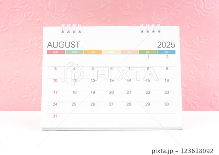 August 2025, Desk calendar with pink flower pattern embossed as background. 123618092