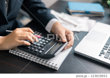 Finance bank tax expense accounting budget money businessman hand use calculator Financial calculate accountant close up calculator with graph chart write office desk Business expense analysis saving Finance bank tax expense accounting budget money businessman hand use calculator Financial calculate accountant close up calculator with graph chart write office desk Business expense analysis saving 123619052