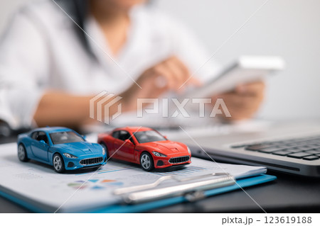 Finance bank tax expense accounting budget money businessman hand for Business expense analysis saving use car Financial calculate accountant close up calculator with graph chart write office desk 123619188