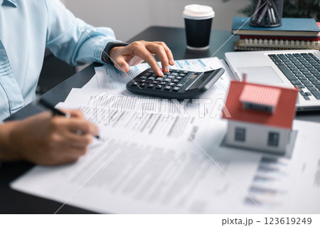 Finance bank tax expense accounting budget money businessman home for Business expense analysis saving use Financial calculate accountant close up calculator with graph chart hand write office desk Finance bank tax expense accounting budget money businessman home for Business expense analysis saving use Financial calculate accountant close up calculator with graph chart hand write office desk 123619249