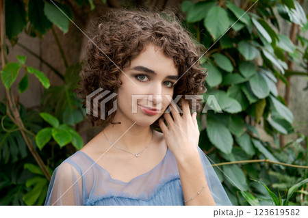 Woman with brown hair and a blue dress Woman with brown hair and a blue dress 123619582