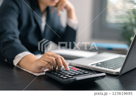 Finance bank tax expense accounting budget money businessman hand use calculator Financial calculate accountant close up calculator with graph chart write office desk Business expense analysis saving Finance bank tax expense accounting budget money businessman hand use calculator Financial calculate accountant close up calculator with graph chart write office desk Business expense analysis saving 123619695