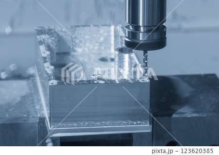 The tapping process on CNC milling machine in the light blue scene. The tapping process on CNC milling machine in the light blue scene. 123620385