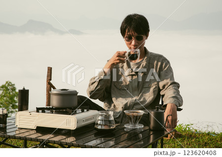 Morning coffee concept of cafe focus on nurturing coffee in harmony with nature organic seed create warm cup caffeine background green fresh great outdoor. aromatic drink rich aroma of rising from mug 123620408
