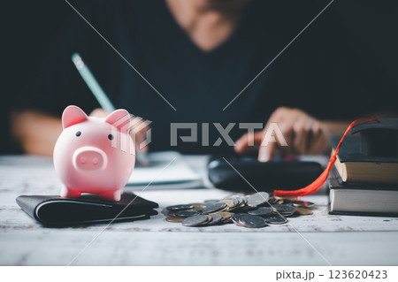 Saving money coin with banking investment, finance education concept. Planning student loan for studying abroad for college or university degree. Future children's education fund cash. Growing Saving money coin with banking investment, finance education concept. Planning student loan for studying abroad for college or university degree. Future children's education fund cash. Growing 123620423
