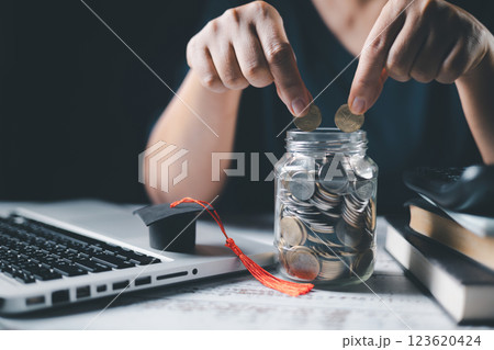 Saving money coin with banking investment, finance education concept. Planning student loan for studying abroad for college or university degree. Future children's education fund cash. Growing Saving money coin with banking investment, finance education concept. Planning student loan for studying abroad for college or university degree. Future children's education fund cash. Growing 123620424