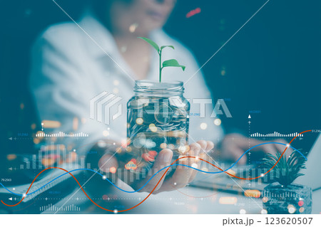 Businesswoman working with modern computer calculator virtual dashboard analyzing finance sales data and economic growth graph chart and account report technology. 123620507