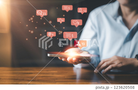 Woman hand using smartphone and show technology icon social media. Concept social network. hand using mobile smartphone with icon social media and social network. Online marketing concept. Woman hand using smartphone and show technology icon social media. Concept social network. hand using mobile smartphone with icon social media and social network. Online marketing concept. 123620508