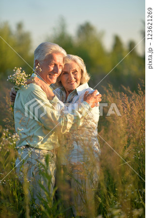 Loving mature couple in the park in summer Loving mature couple in the park in summer 123621269