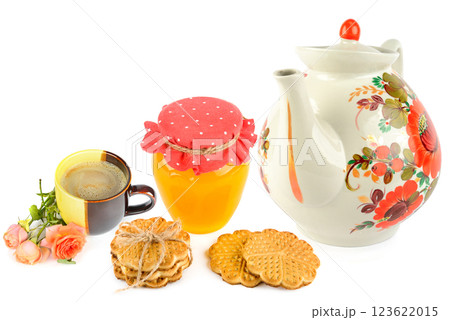 Porcelain teapot, honey, milk tea and cookies isolated on white background. Collage. 123622015