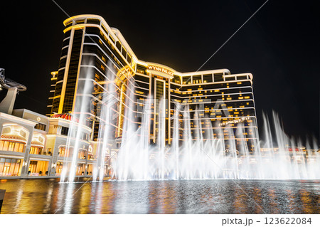Beautiful night view of Wynn Palace Performance Lake displays a water, music, and light show, is a hotel casino resort on the Cotai Strip in Macau, China. 123622084