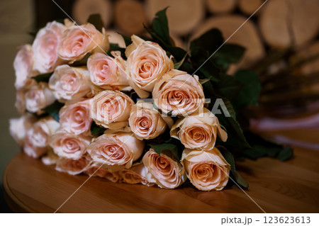 Elegant Bunch of Pale Pink Roses on a Wooden Surface Elegant Bunch of Pale Pink Roses on a Wooden Surface 123623613