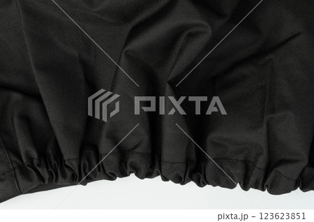 Black fabric with gathered edge showcasing texture and design for sewing projects Black fabric with gathered edge showcasing texture and design for sewing projects 123623851