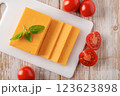 Sheddar cheese slices and tomatoes closeup. 123623898