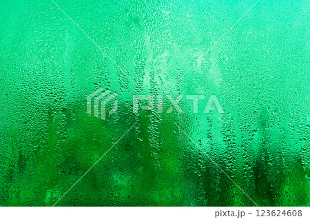 abstract wet glass background. green colors abstract wet glass background. green colors 123624608