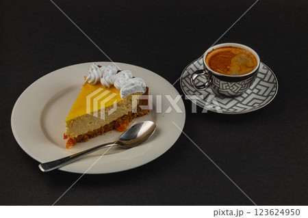 Delightful dessert plate featuring creamy cheesecake and espresso beverage Delightful dessert plate featuring creamy cheesecake and espresso beverage 123624950