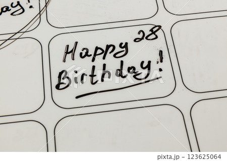 Birthday message written in black ink on a white calendar date box Birthday message written in black ink on a white calendar date box 123625064