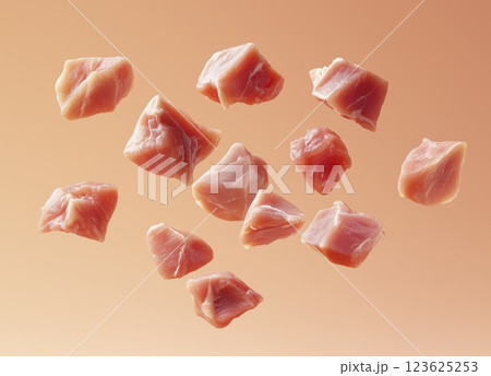 Fresh raw chicken fillet pieces floating in air, falling motion on soft background 123625253