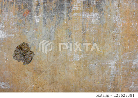 concrete wall with yellow stains impact damage and plaster leftovers concrete wall with yellow stains impact damage and plaster leftovers 123625381