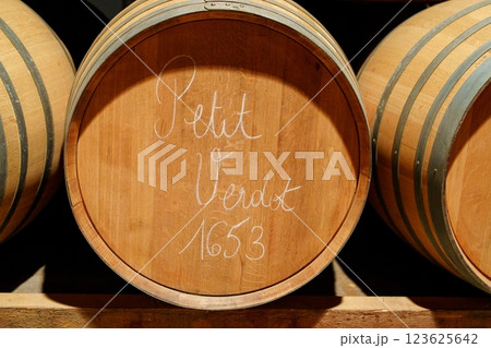 Rustic Oak Wine Barrel With White Lettering Indicating Wine Variety 123625642