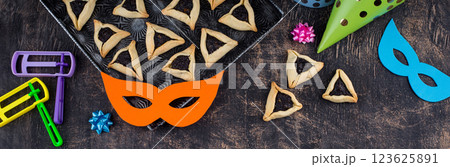 Jewish holiday Purim with carnival mask and cookies Hamantaschen Jewish holiday Purim with carnival mask and cookies Hamantaschen 123625891