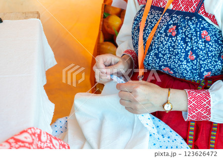 Traditional Russian Folk Embroidery - Woman Embroidering a Traditional Pattern Traditional Russian Folk Embroidery - Woman Embroidering a Traditional Pattern 123626472