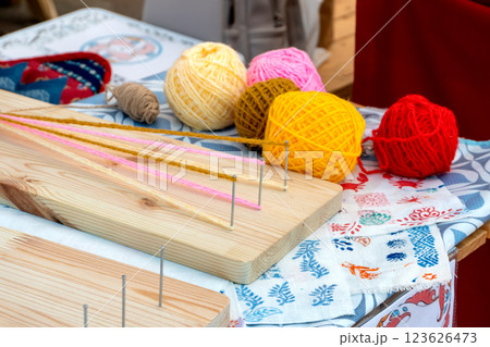Macrame Weaving Tool with Colorful Threads - Traditional Folk Craft Macrame Weaving Tool with Colorful Threads - Traditional Folk Craft 123626473