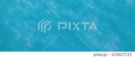 Texture blue and turquoise color felt background with spots of fabric, macro. Structure of woolen cerulean textile 123627133