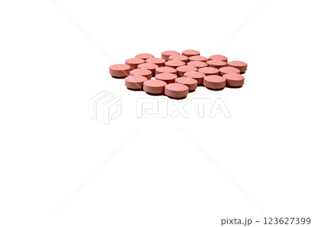 Selective focus of a handful of pills on the white background. Pharmacist. Medicine Selective focus of a handful of pills on the white background. Pharmacist. Medicine 123627399