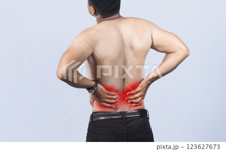Person with back problems on isolated background, lumbar problems concept, A man with spine problems, a sore person with back pain Person with back problems on isolated background, lumbar problems concept, A man with spine problems, a sore person with back pain 123627673