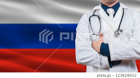 Male Doctor With Stethoscope On Russian Flag. Doctor Holding Stethoscope On Russian Flag 123628012