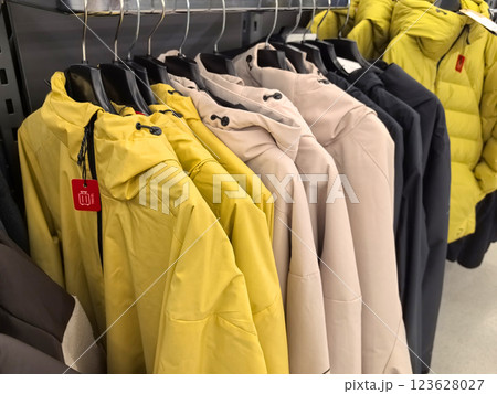 Vibrant jackets display in a cozy retail corner during autumn season 123628027