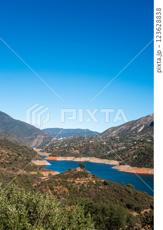 Scenic mountainous landscape with lush greenery and serene lake under clear blue sky, La Concepcion Scenic mountainous landscape with lush greenery and serene lake under clear blue sky, La Concepcion 123628838