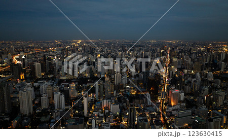 Bangkok at nighttime with streets and buildings illuminated, vibrant atmosphere reflecting the city with energetic lifestyle. Bangkok, Thailand. 123630415