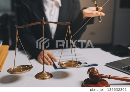 Judge gavel with Justice lawyers having team meeting at law firm background. Concepts of Law and Legal services. 123632261