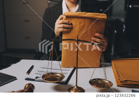 Judge gavel with Justice lawyers having team meeting at law firm background. Concepts of Law and Legal services. Judge gavel with Justice lawyers having team meeting at law firm background. Concepts of Law and Legal services. 123632266