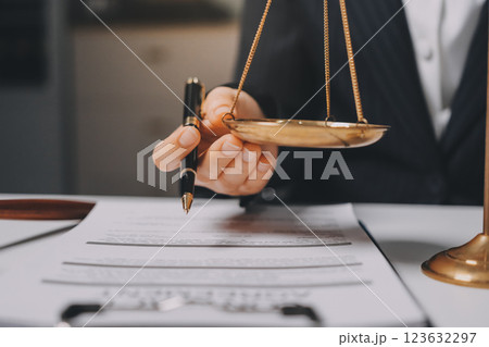 Judge gavel with Justice lawyers having team meeting at law firm background. Concepts of Law and Legal services. 123632297