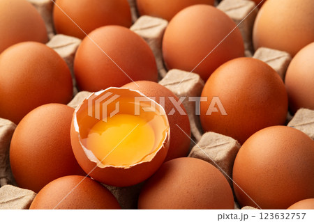 Close up fresh raw open egg on egg tray background Close up fresh raw open egg on egg tray background 123632757
